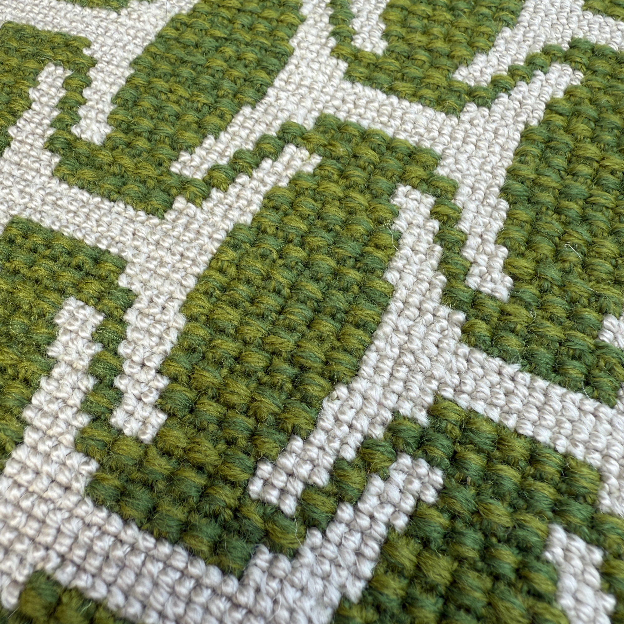 EthiopianHatNeedlepointCushionGreenDetail-FineCellWork.png
