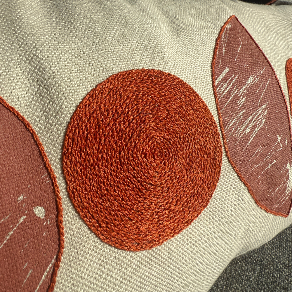 Hand-EmbroideredSilhouetteBurntOrangeCushionbyMargitWittigDetail-FineCellWork.png