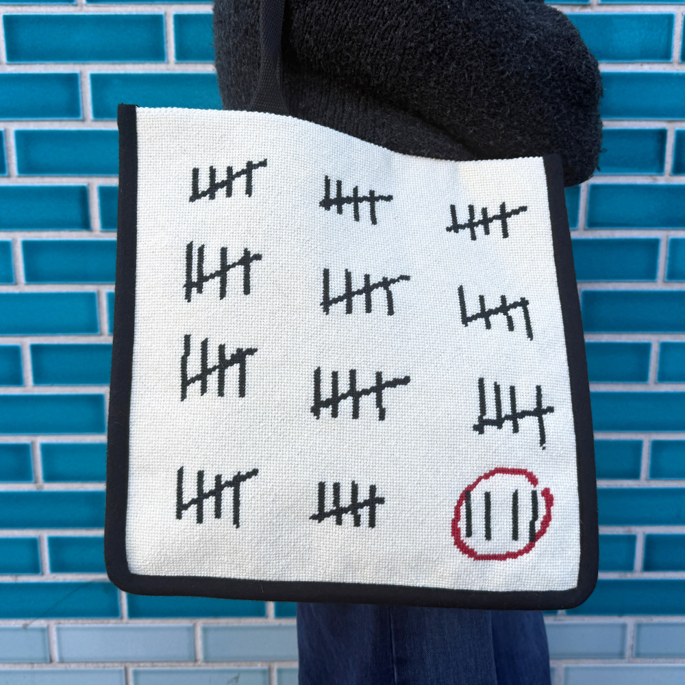 WhitePrisonCalendarNeedlepointToteBagbyA.A.Gill-FineCellWork_396383c2-01eb-4364-acfa-f6ac74520d9a.png
